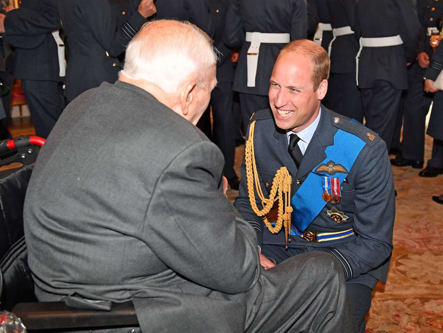 The Duke of Cambridge speaks with Wing Commander Jock Heatherill, a bomb aimer in the war, at an RAF reception at Buckingham Palace in 2018 (Phil Harris/Daily Mirror/PA)