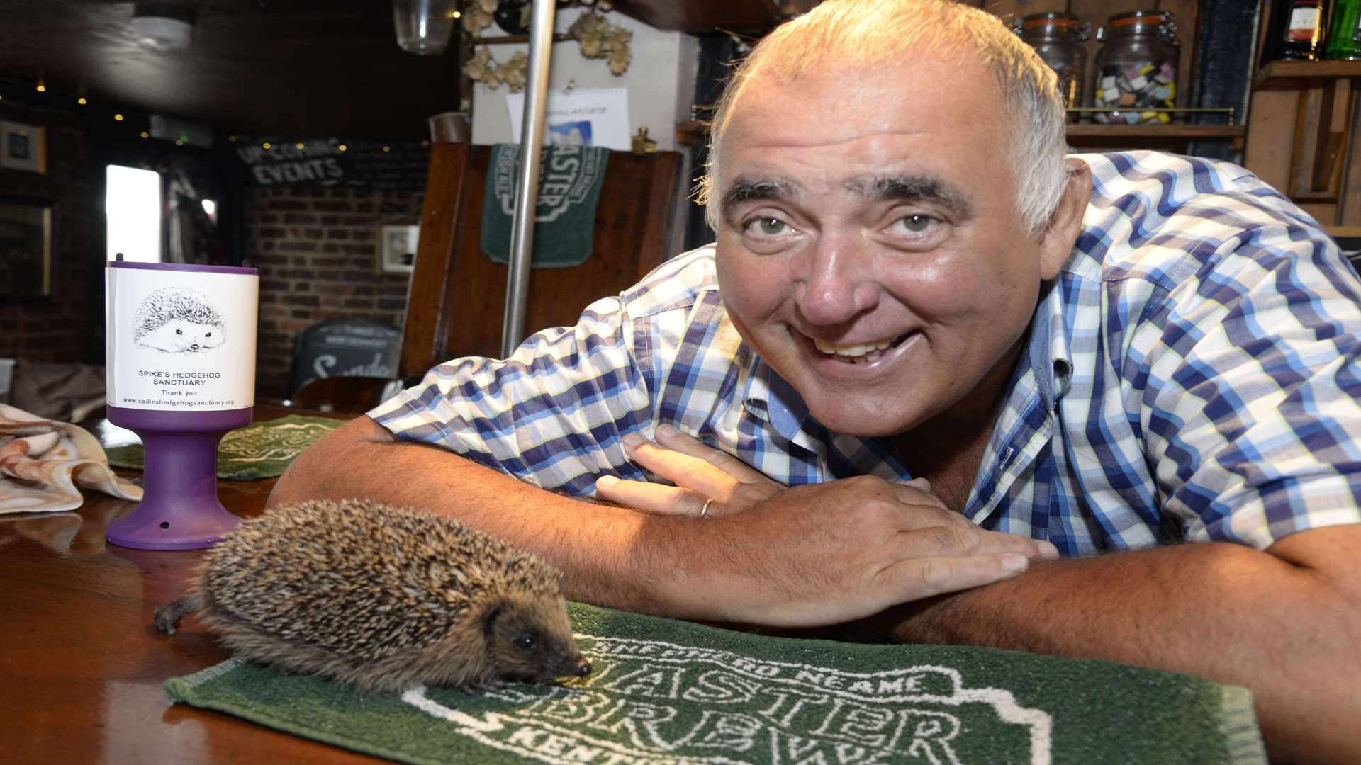Landlord of the Three Horseshoes, Staplestreet, near Faversham, Clive 'Buster' McDonnell meets Buster the baby hedgehog