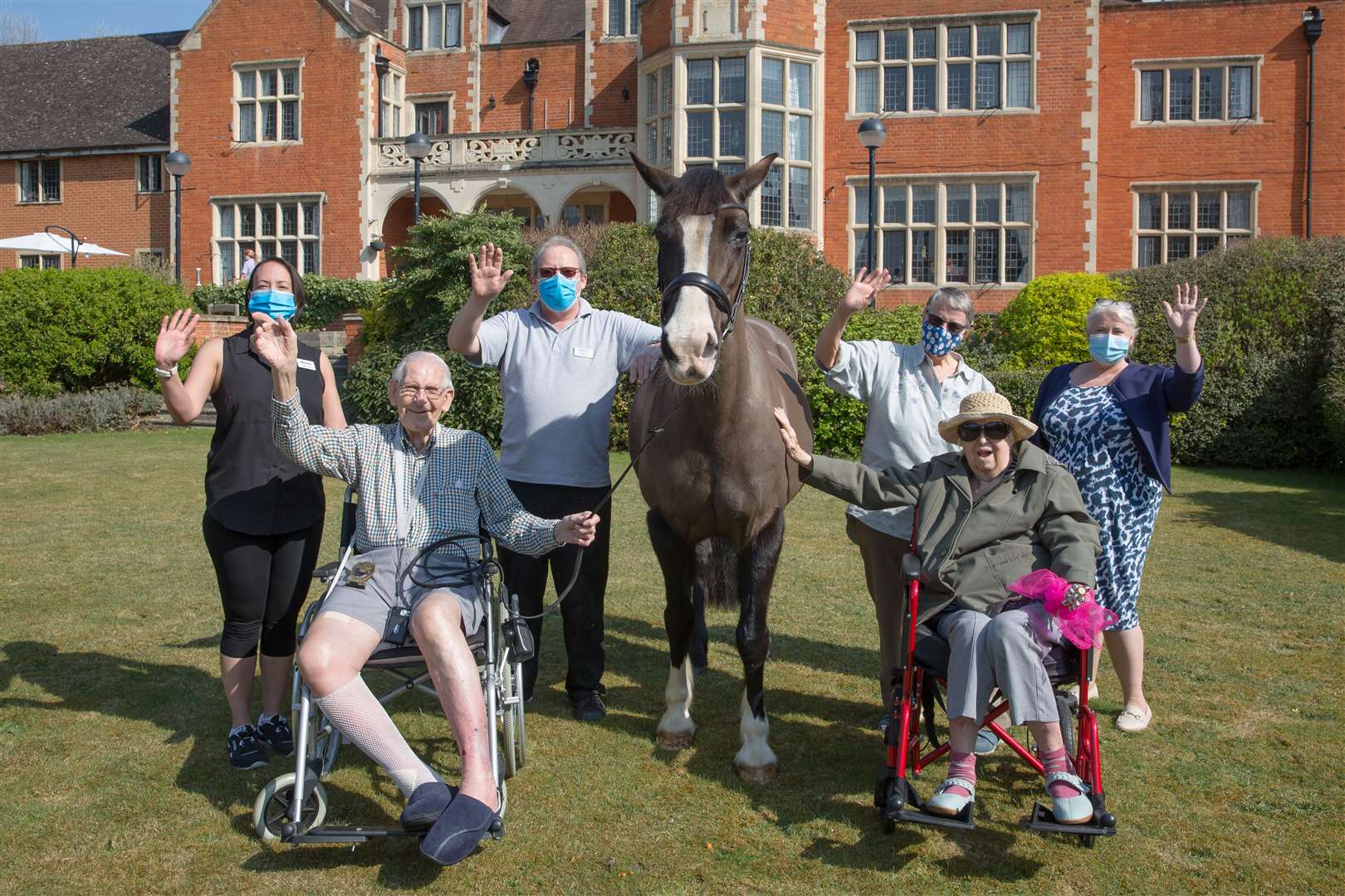 Residents at the home enjoy the company of Rosie (Andrew Williams/Care UK/PA)