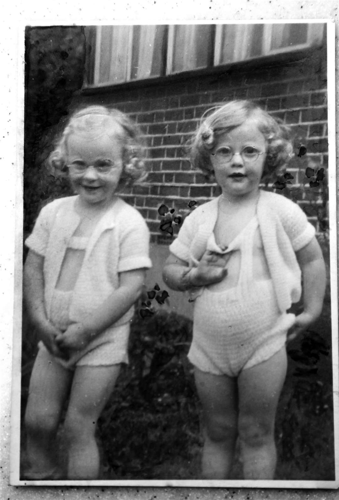 Helen Mill of Oakwood Court Maidstone has been sharing her memories of the war, with a picture of her (right) and her twin sister Wendy as a child.Picture: Sean AidanPhoto of Wendy and Helen (right) as children. (10537971)