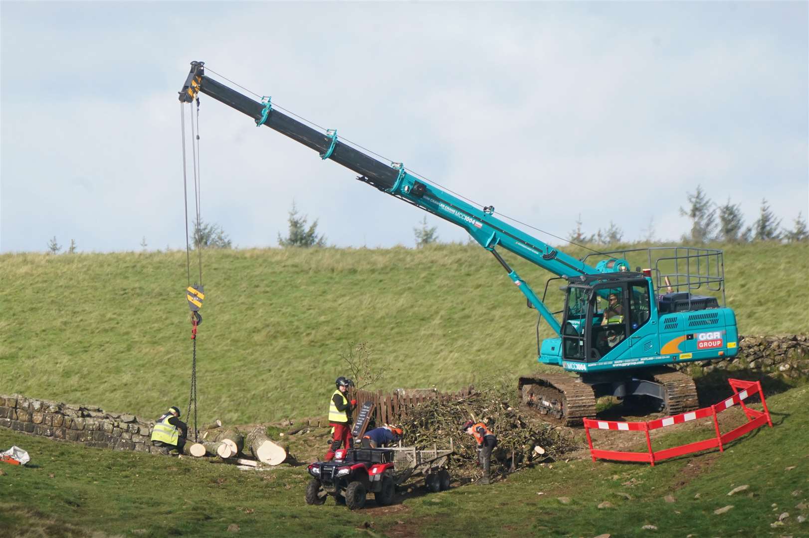 Work begins in the removal of the felled Sycamore Gap tree (Owen Humphreys/PA)