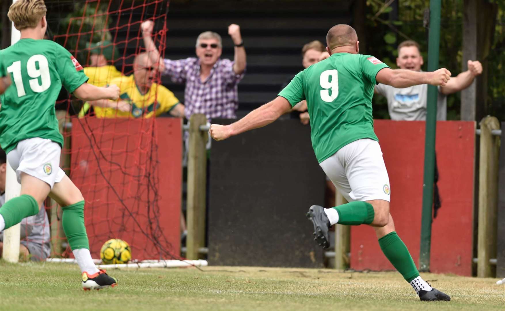 Gary Lockyer wheels away in celebration after putting Ashford ahead in stoppage time against Erith Town. Picture: Ian Scammell