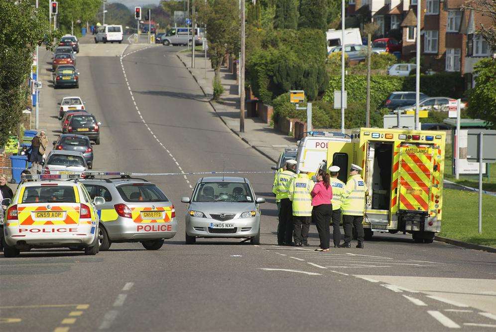 Police cars block off road where crash happened