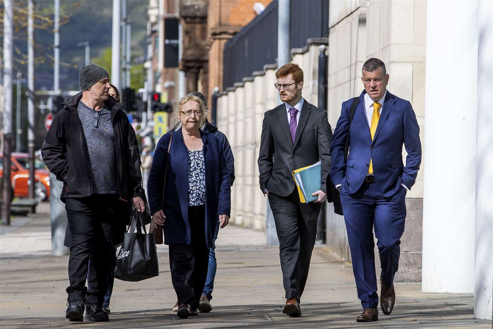 Joe McCann’s widow Anne, centre, and family with their solicitor Niall Murphy, right (Liam McBurney/PA)