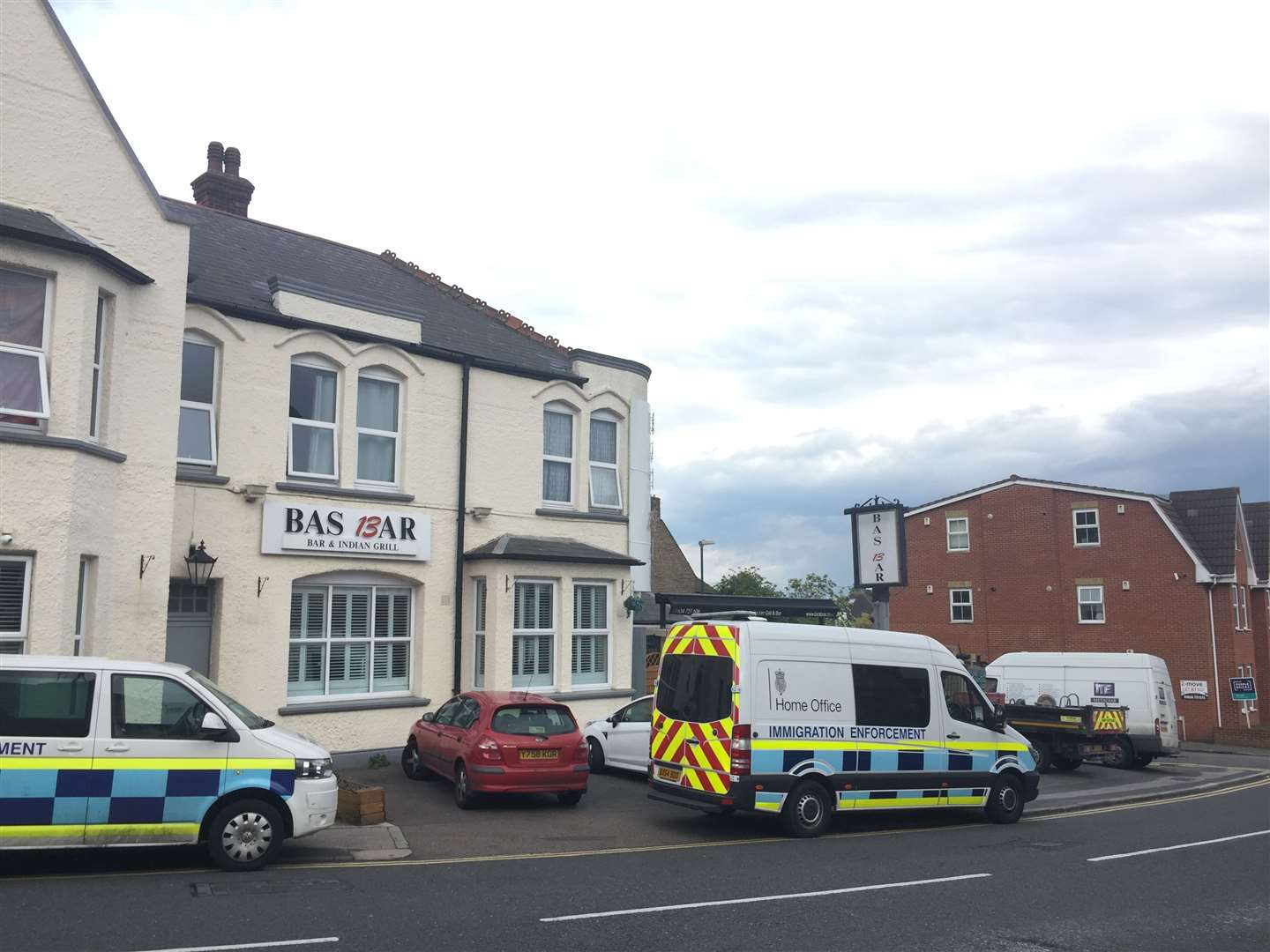 Home Office immigration vans outside the Bas Bar in Strood