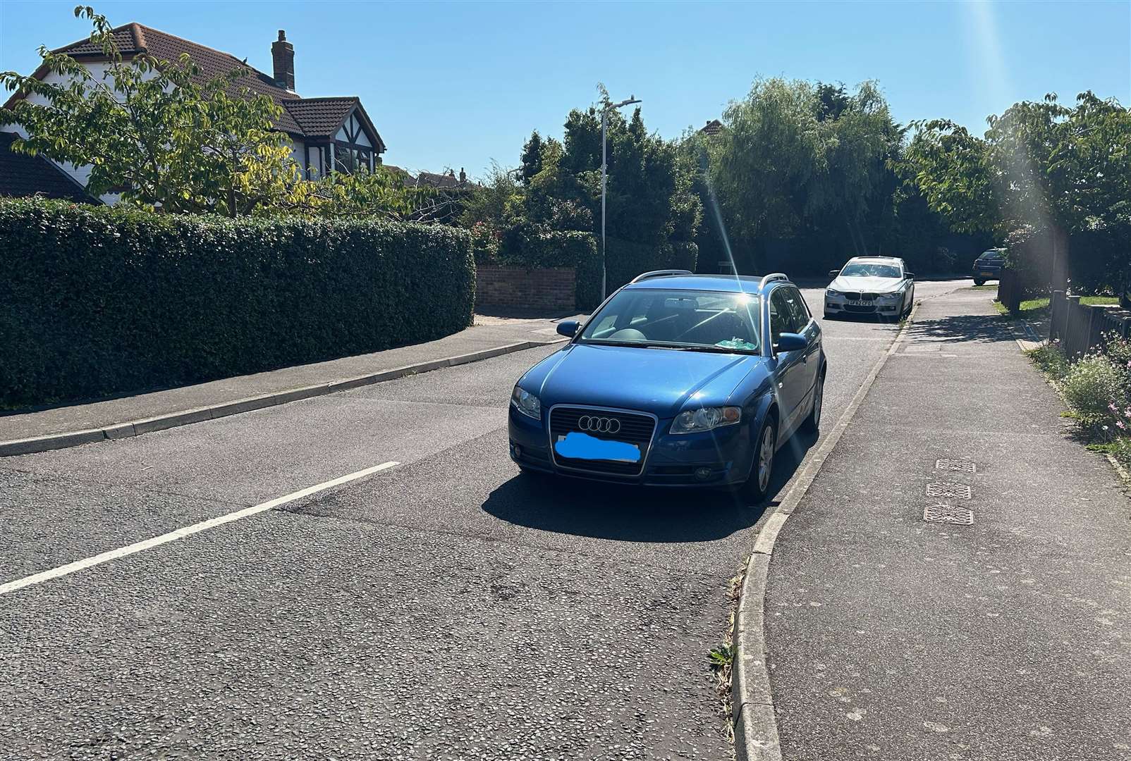 Parked cars in Wraightsfield Avenue, Dymchurch, force drivers to "go on the wrong side of the road" when joining the A259