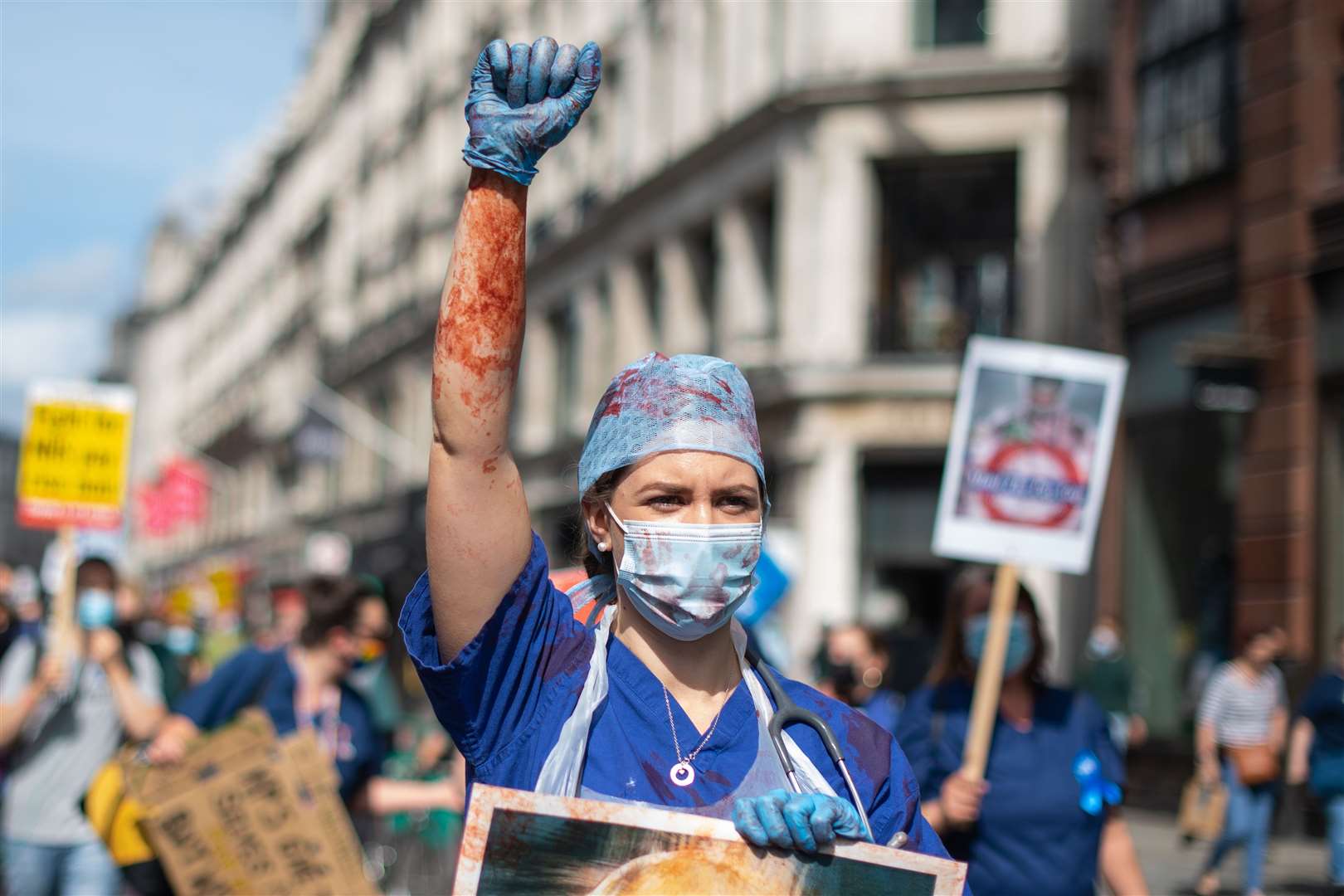 NHS staff and supporters march along Regent Street (Dominic Lipinski/PA)