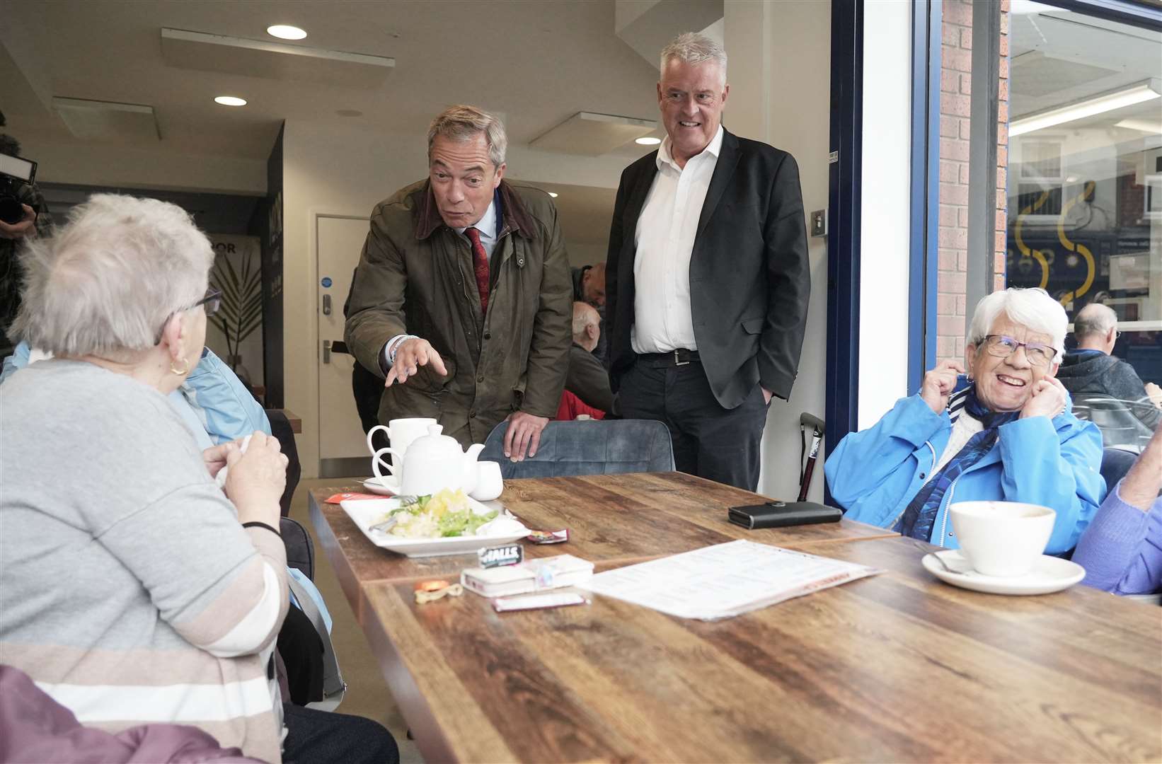 Mr Farage then joined Lee Anderson, Reform UK parliamentary candidate and former Conservative MP, in a cafe in Ashfield (Dominic Lipinski/PA)