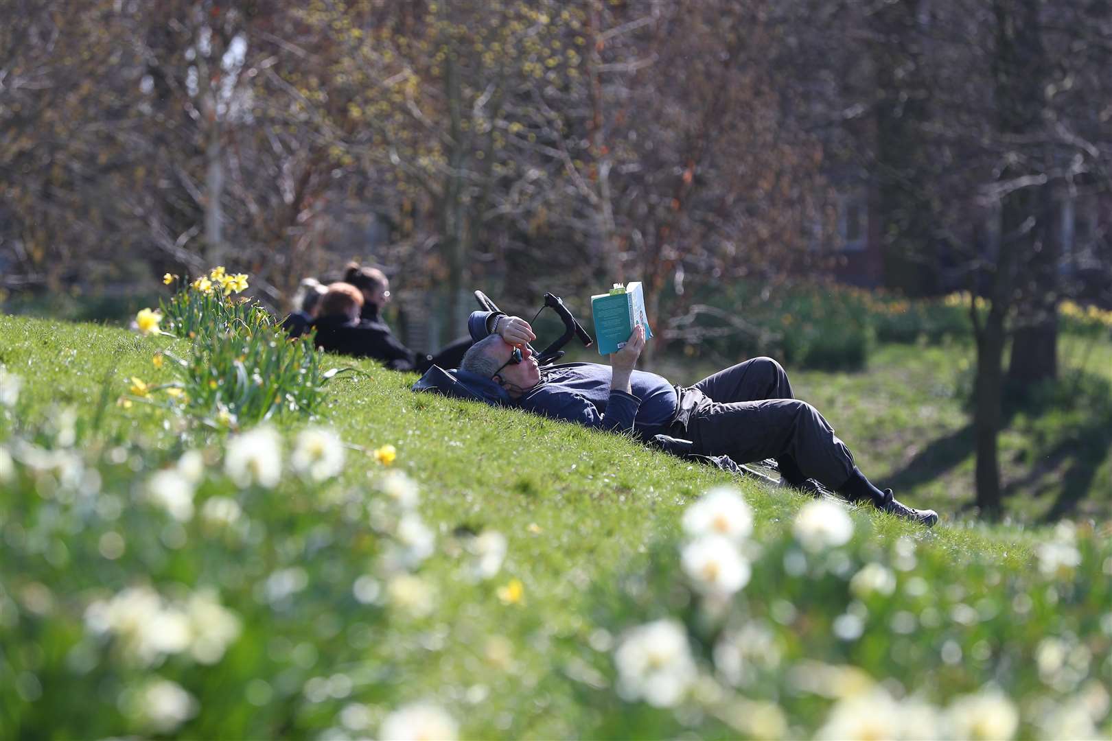 Soaking up the rays in Sefton Park (Peter Byrne/PA)