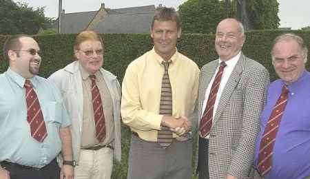 IT'S A DEAL: Medway Messenger sports editor Mike Rees with the league's chairman Alan Barty and members of the committee