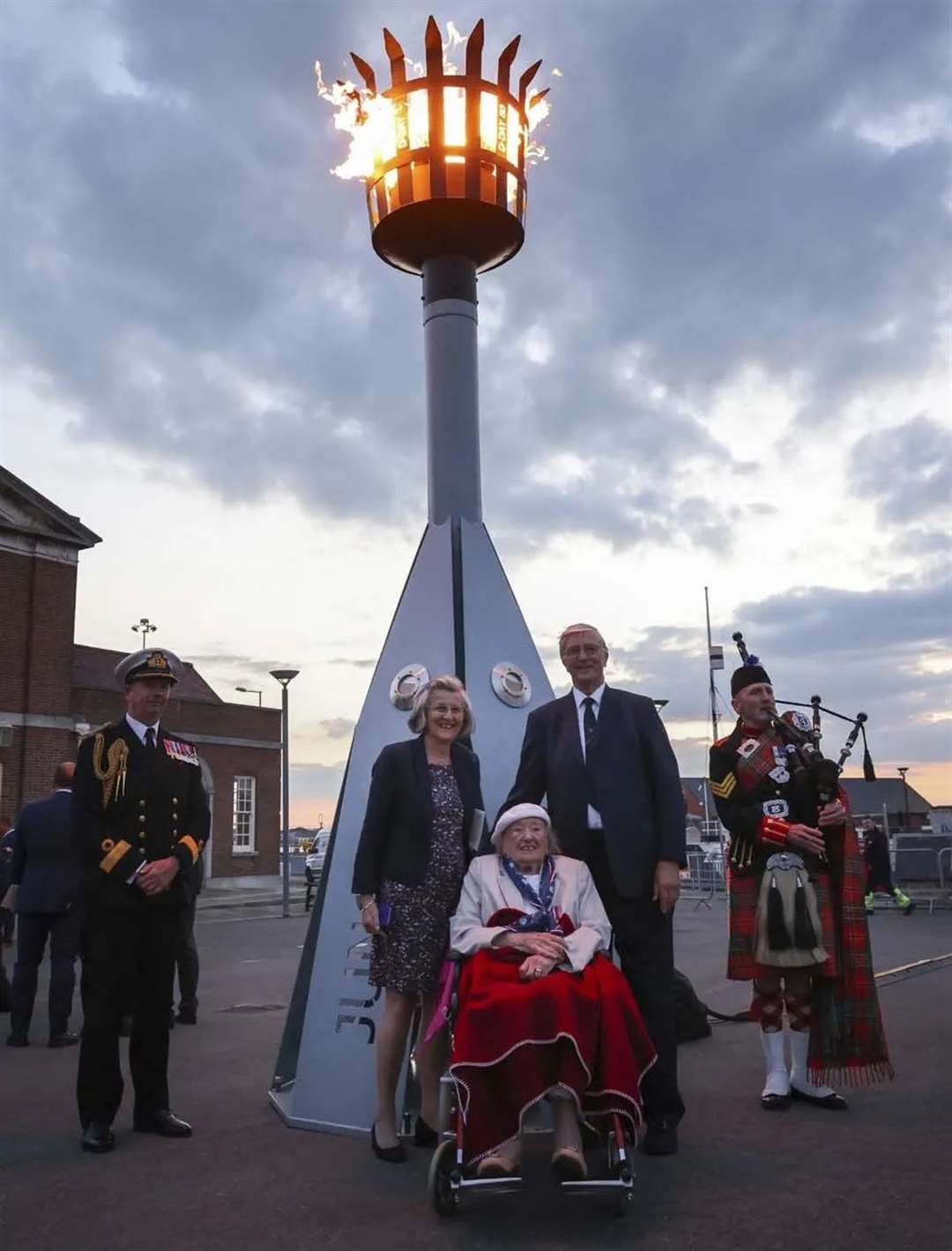 Vera with her family in front of the beacon for the 80th anniversary of the D-Day landings. Picture: Royal Navy