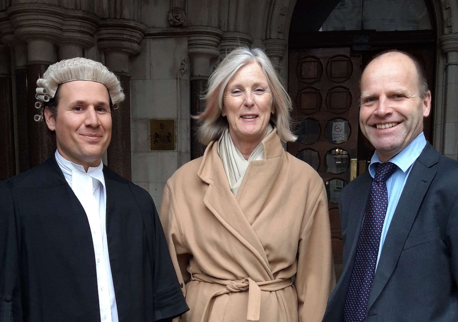 Pictured outside the High Court from left, Daniel Piccinin of Brick Court Chambers, Mrs Thomson and Paul Taylor of Richard Buxton Ltd solicitors. Picture courtesy of Goodwin Sands SOS