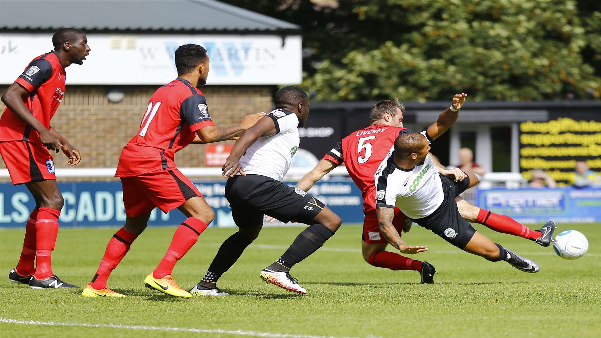 Dover's Ross Lafayette (25) clashes with Barrow's defender Danny Livesey on Saturday Picture: Matt Bristow