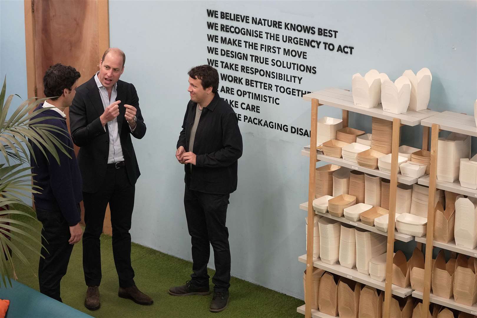 The Prince of Wales talks to co-founders Rodrigo Garcia Gonzalez, left, and Pierre Paslier during a visit to Notpla in London (Kin Cheung/PA)