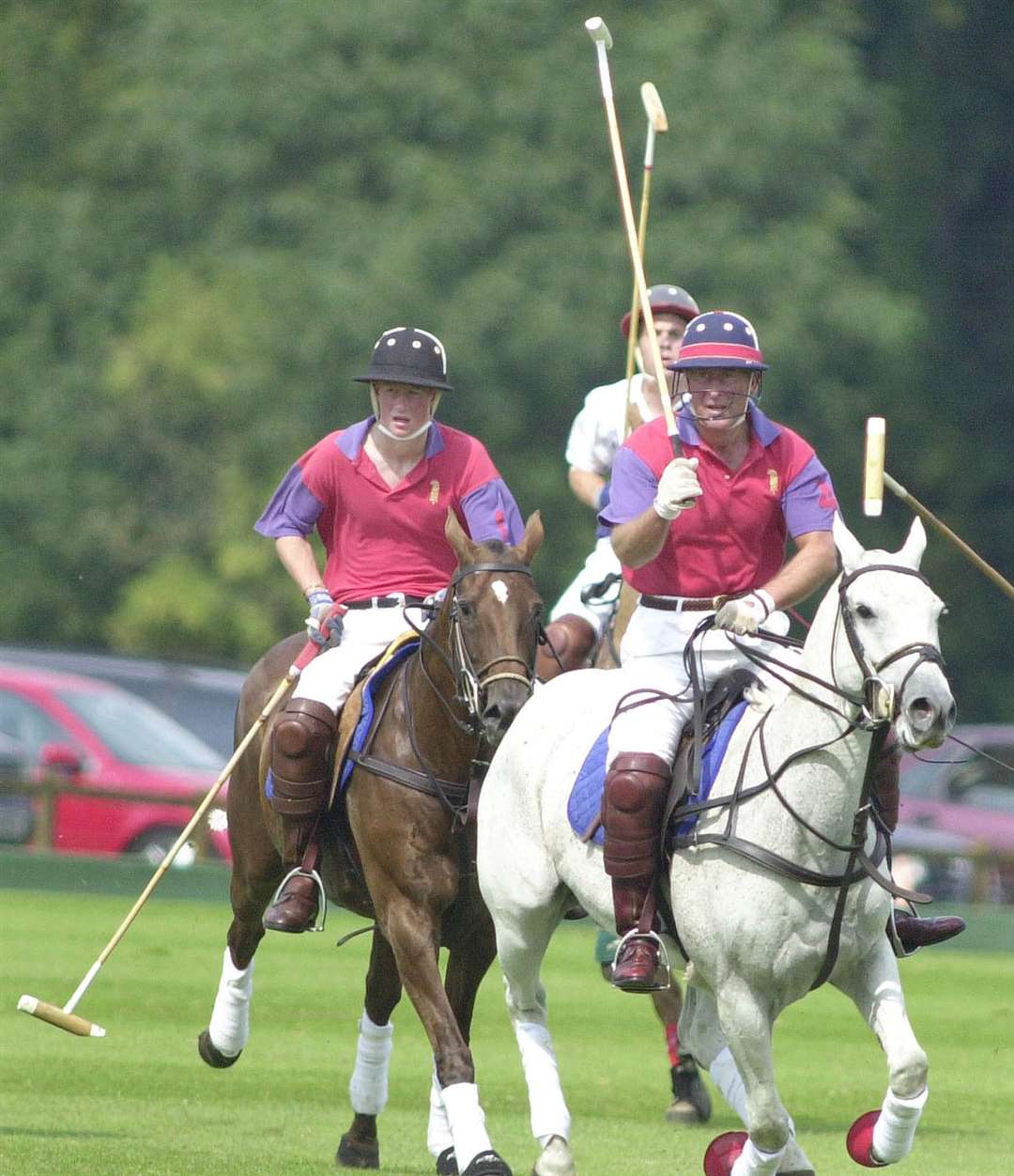 Prince Harry playing polo with his father the then Prince of Wales for Highgrove in an exhibition match against Cirencester Park (Barry Batchelor/PA)