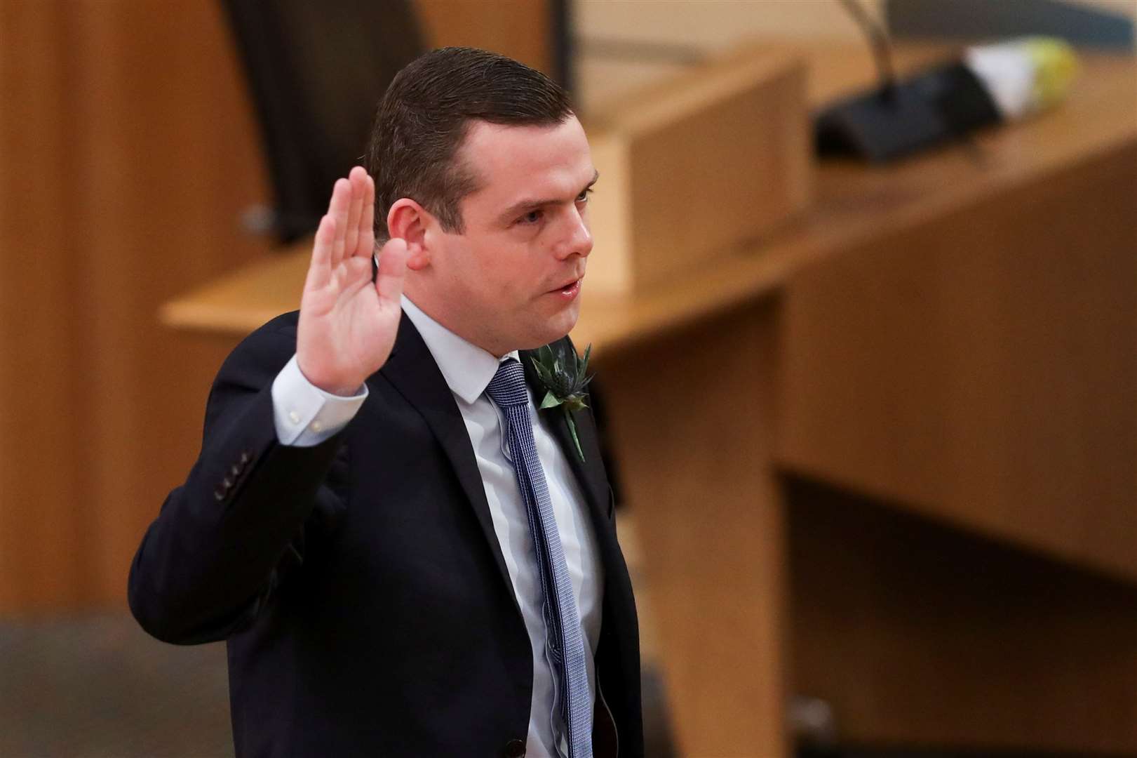 Douglas Ross, leader of the Scottish Conservatives, takes the oath (Russell Cheyne/PA)