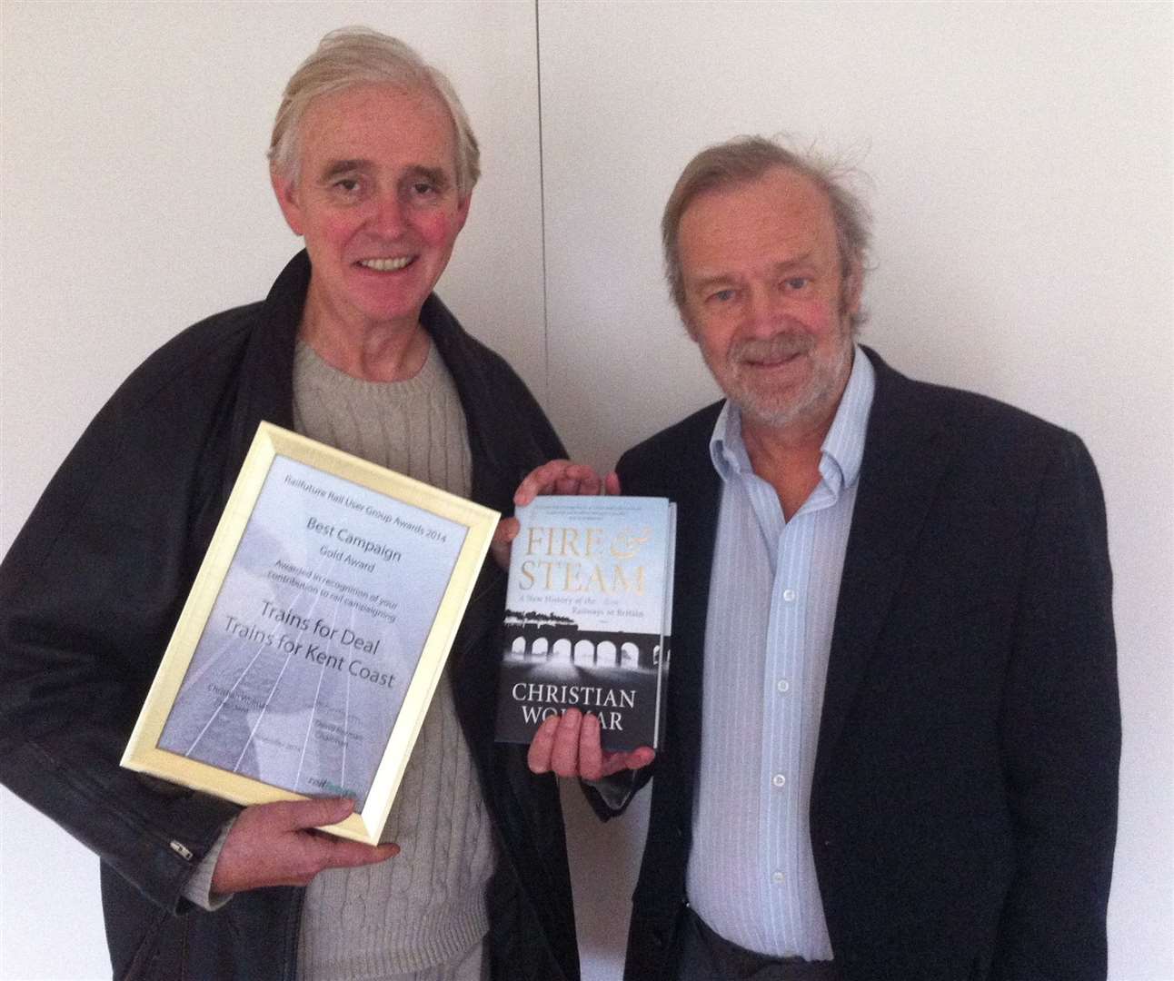 Ian Killbery, right, and Tom Rowland in 2014 after being awarded for helping bring a full time high speed service to Deal. Submitted picture