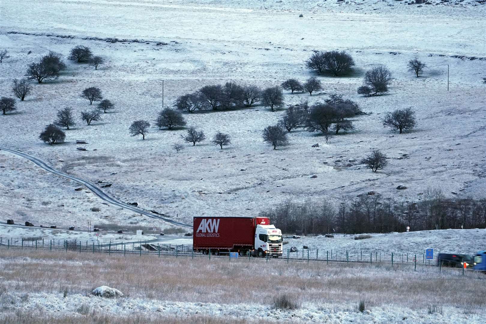 Snow settled on the ground during a freezing spell in January (Owen Humphreys/PA)