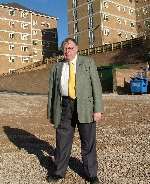 Cllr Steve Kearney in front of the flats in Longhill Avenue