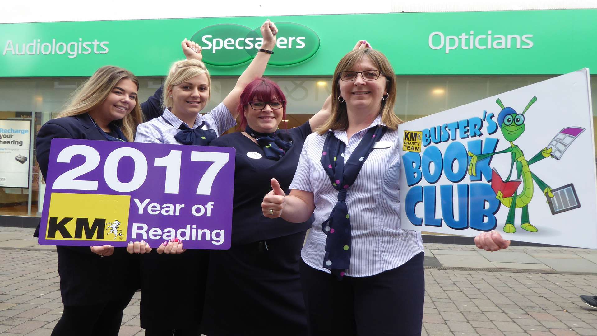 Alison Rudland (right) and Specsavers staff encourage Maidstone parents to read more with their children.