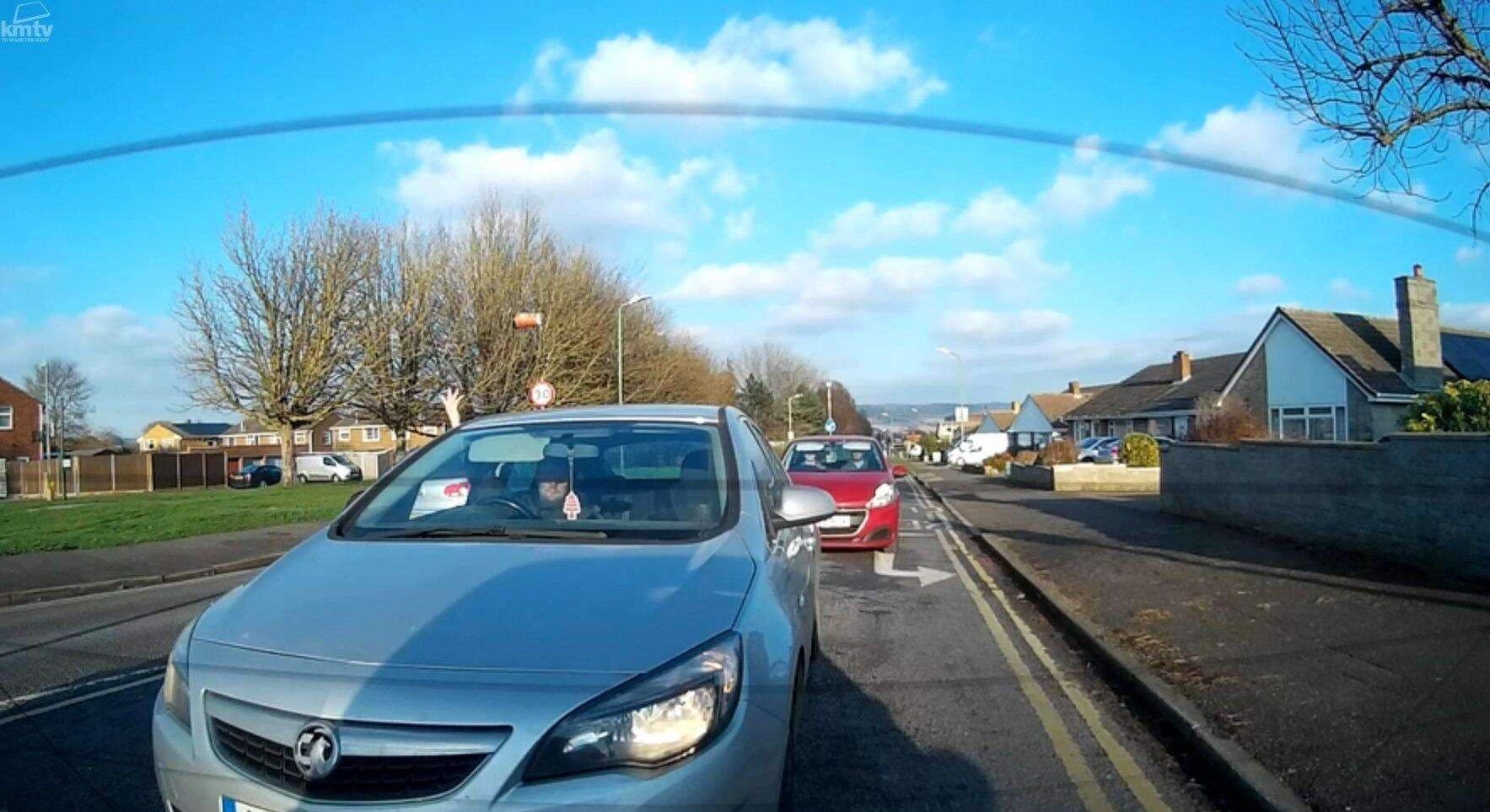 A driver is seen to throw a coffee cup and a bottle from his car (6816202)