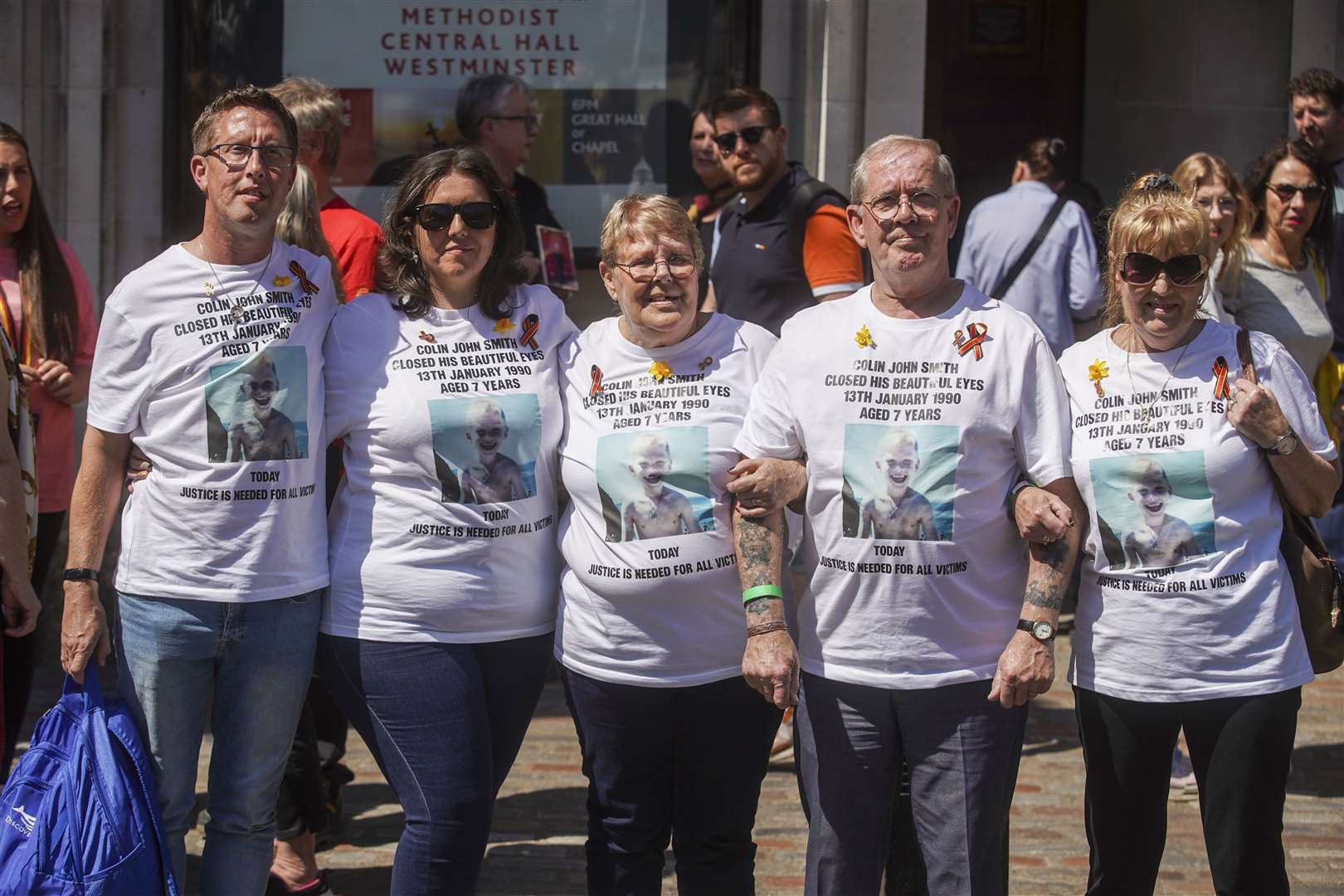 Victims and campaigners outside Central Hall in Westminster, London, after the publication of the Infected Blood Inquiry report (Jeff Moore/PA)