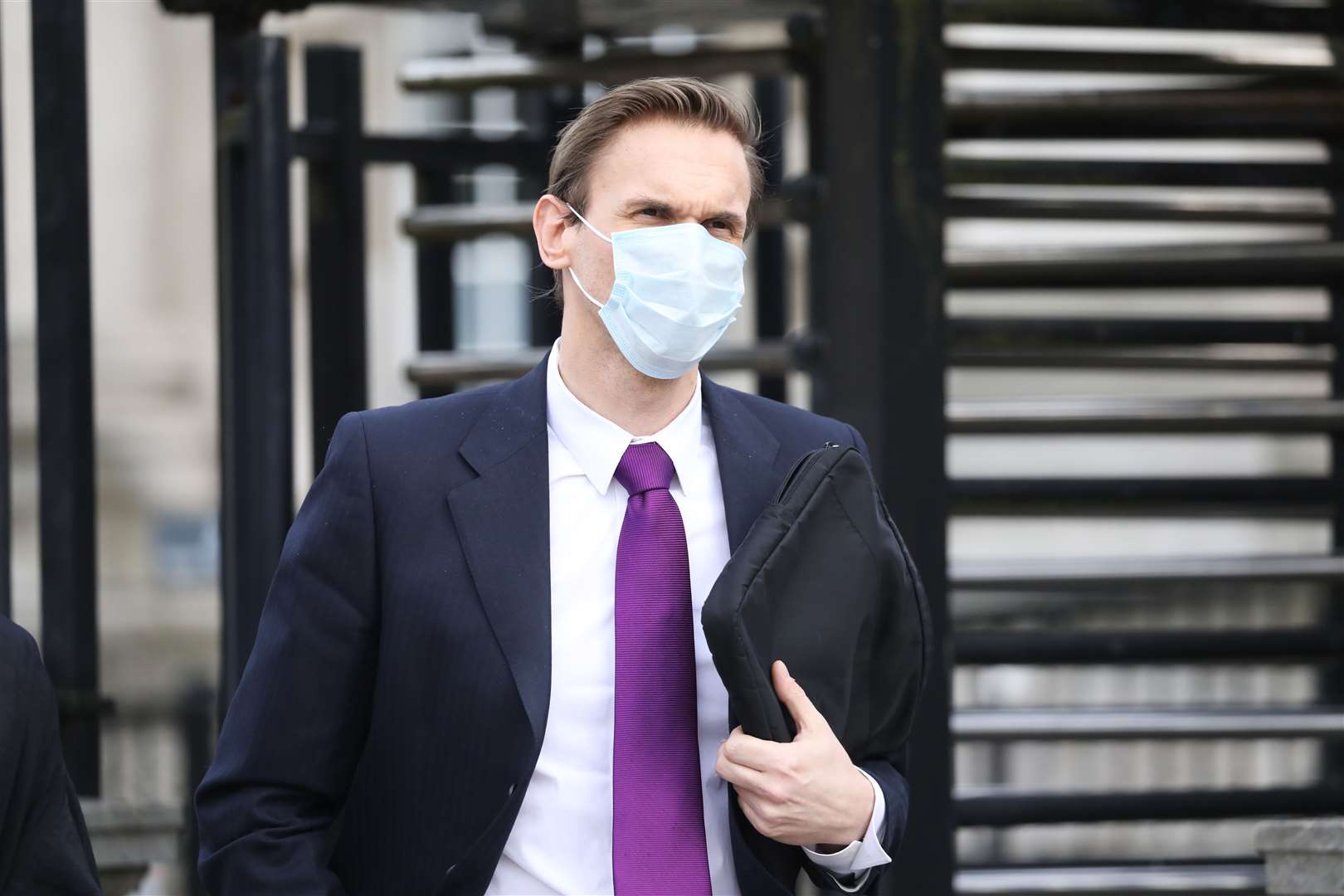 Television presenter Dr Christian Jessen leaves Belfast High Court after giving evidence in defamation proceedings taken against him by First Minister Arlene Foster (Peter Morrison/PA)