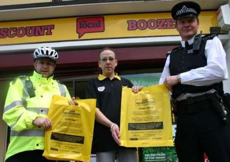 left to right: PCSO Vincent McAnerny, The Local manager Wendy Stephens, and Sgt Conyers with the new bags