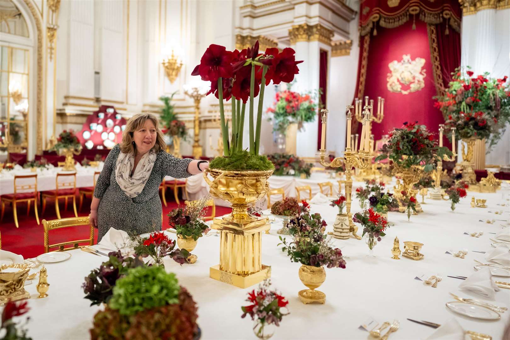 A royal florist checks the table ready for the banquet (Aaron Chown/PA)