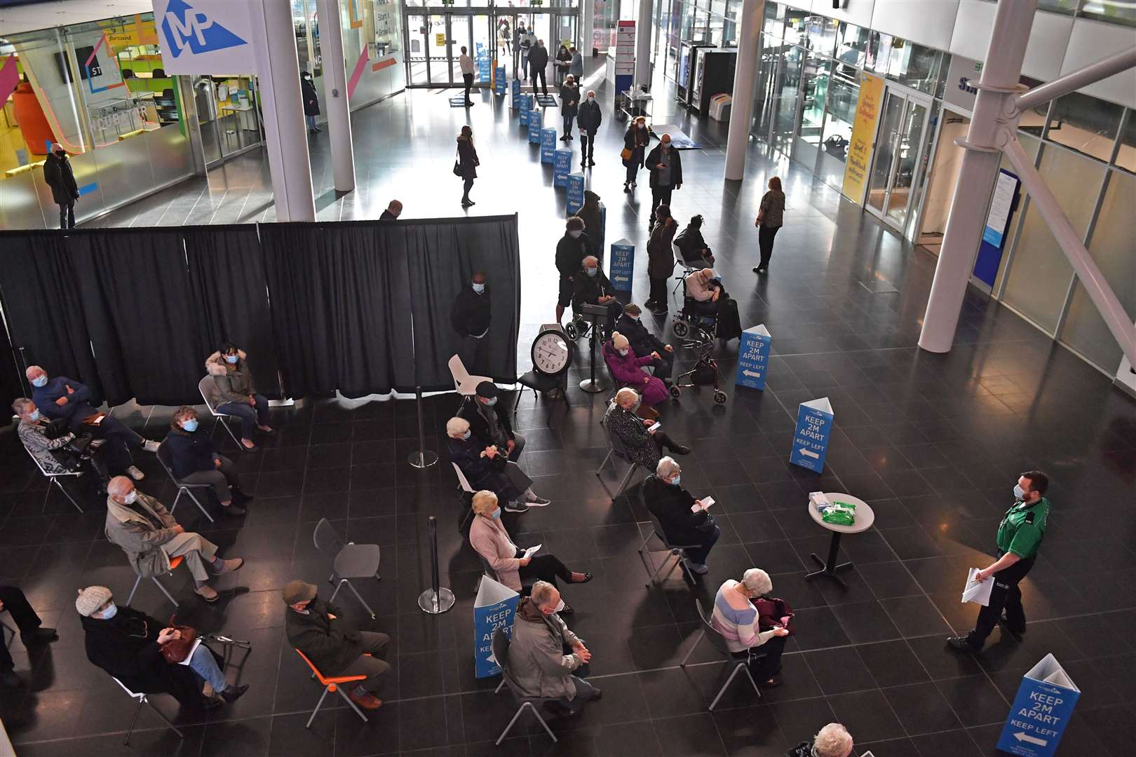 A queue of people waiting for their jab at the Millennium Point centre in Birmingham (Jacob King/PA)