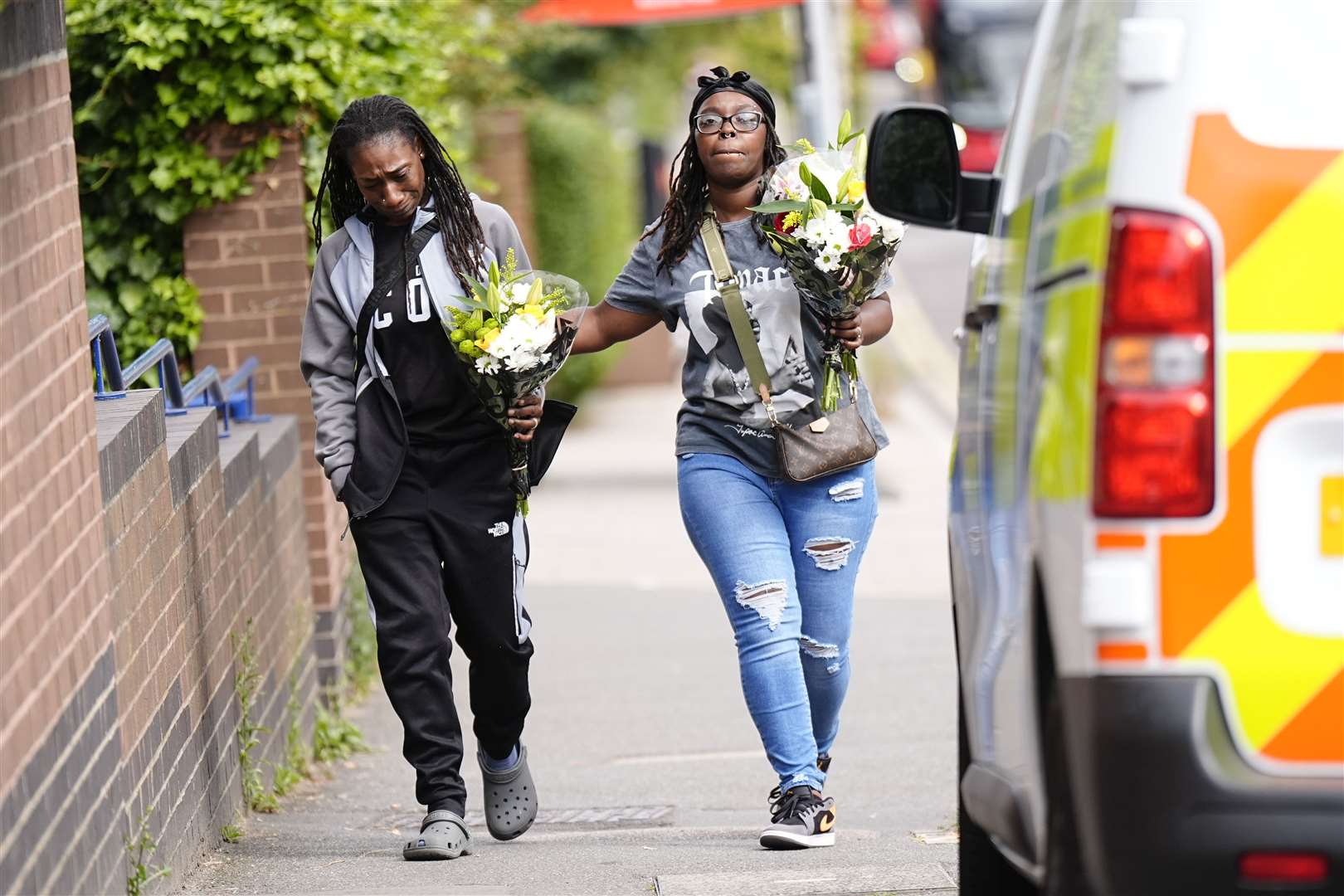 Members of the public arrived at the scene with floral tributes (Aaron Chown/PA)