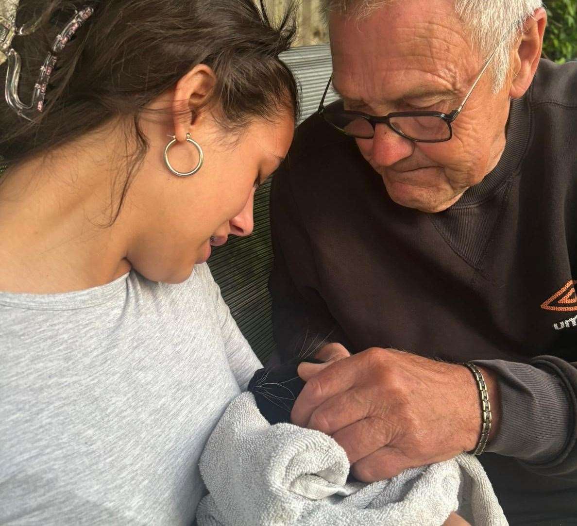 Ashley Hammond-Miller and her grandad Derek with Theo after he was hit by a car in Boughton-under-Blean. Picture: Claire Hammond-Miller