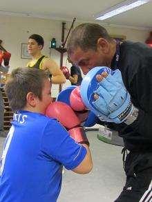 Trainer Michael Seymour with a young boxer