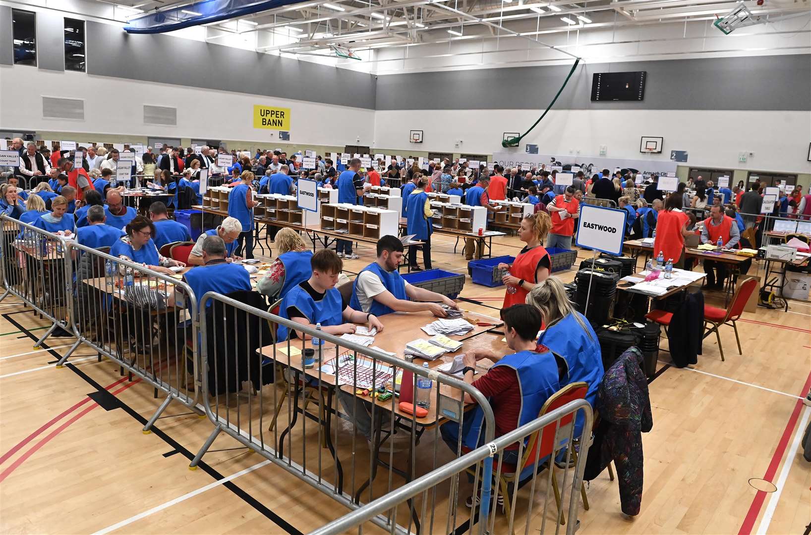 Election workers counting ballots at the South Lake Leisure Centre in Craigavon, Co Armagh (Oliver McVeigh/PA)