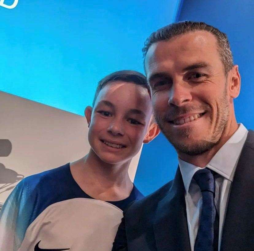 Ashford United youth-team player Callum Pollard on stage with Gareth Bale at the Euro 28 announcement in Switzerland. Picture: X