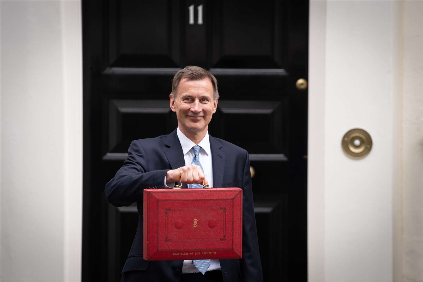 Chancellor of the Exchequer Jeremy Hunt leaves 11 Downing Street, London, with his ministerial box before delivering his Budget at the Houses of Parliament (Stefan Rousseau/PA)