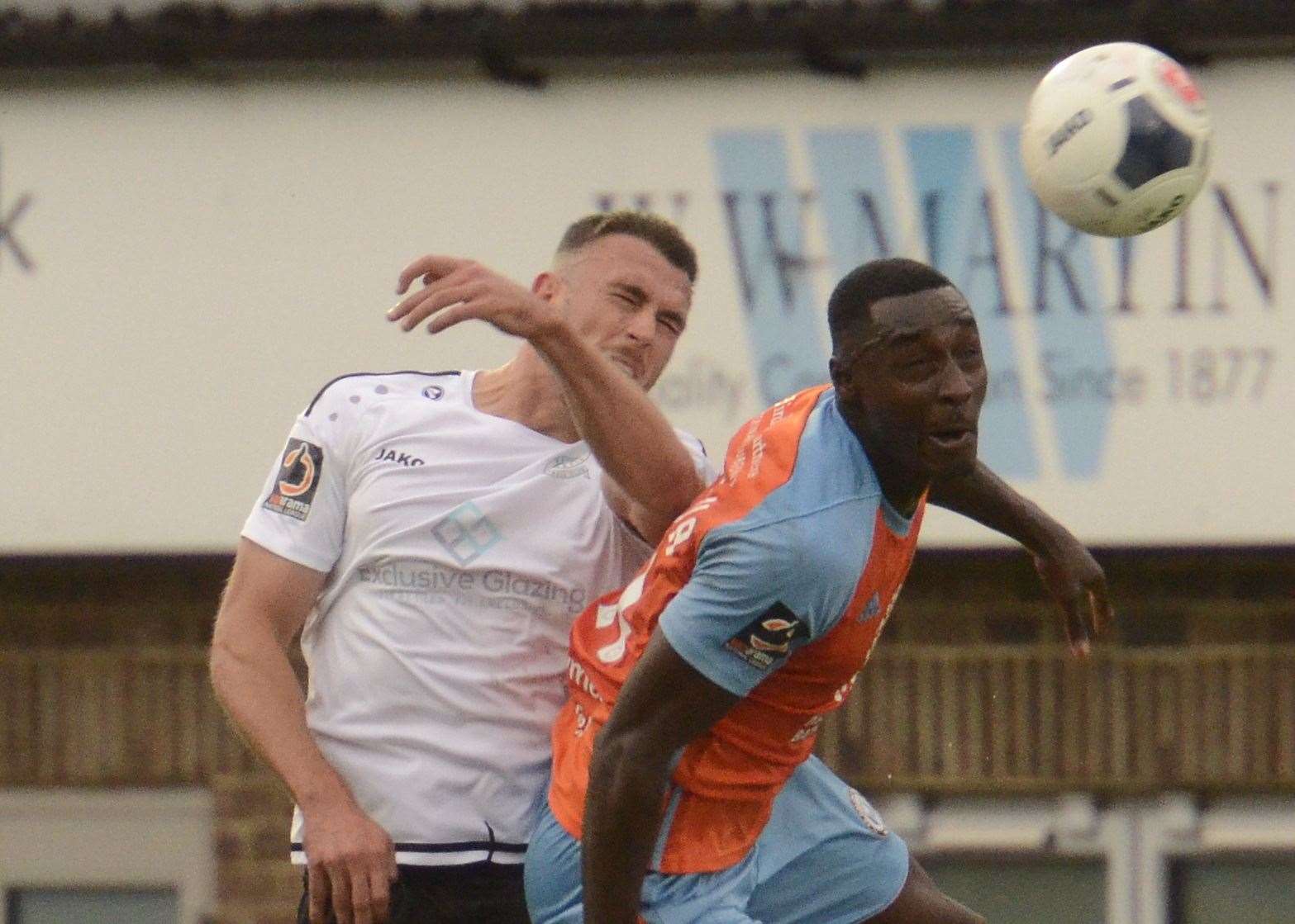 Dover defender Will De Havilland wins this aerial battle with Halifax striker Tobi Sho-Silva Picture:Chris Davey