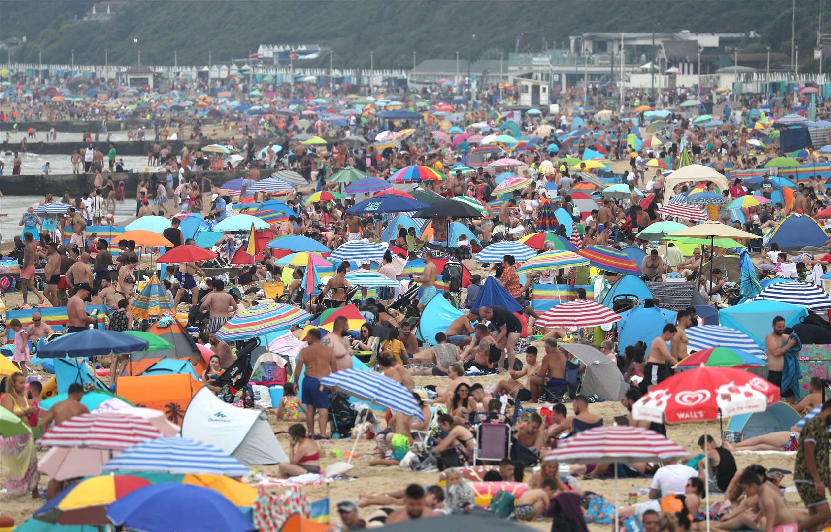 People enjoy the hot weather at Bournemouth beach in Dorset (Andrew Matthews/PA)