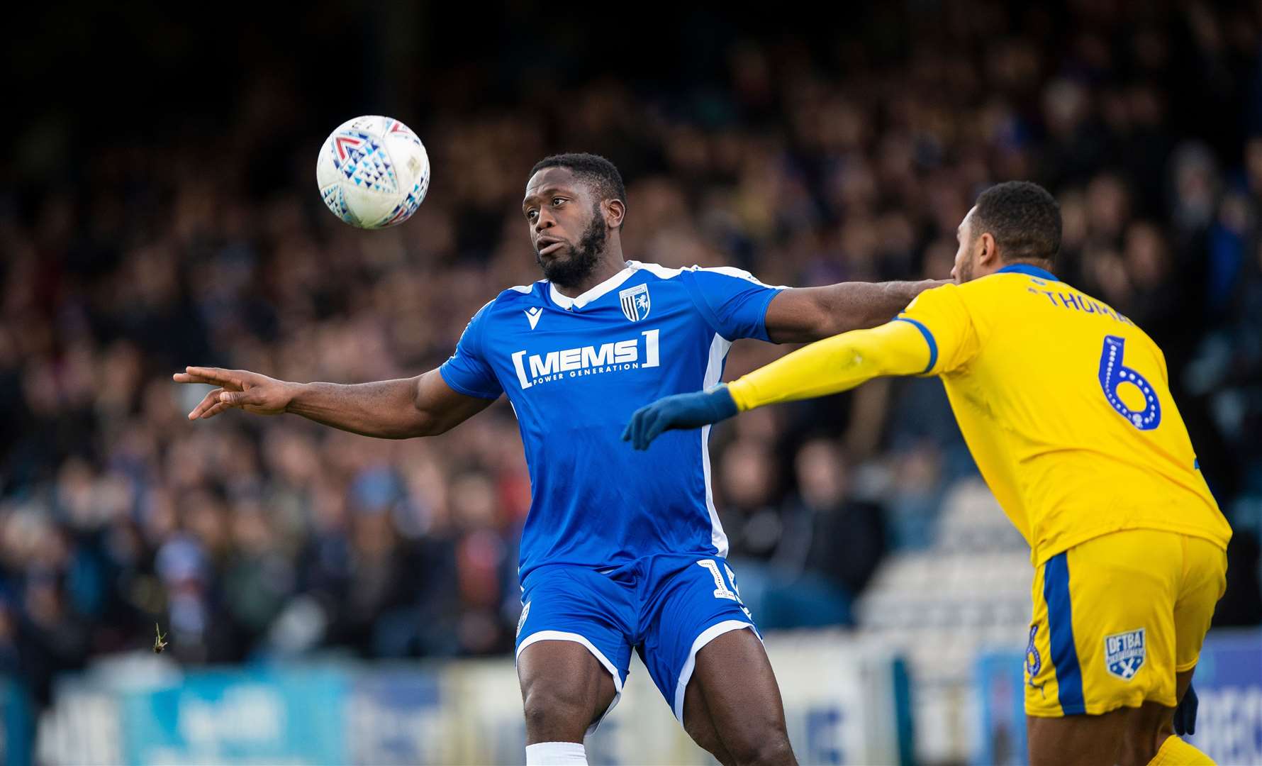 Gillingham striker John Akinde up against AFC Wimbledon at Priestfield last season