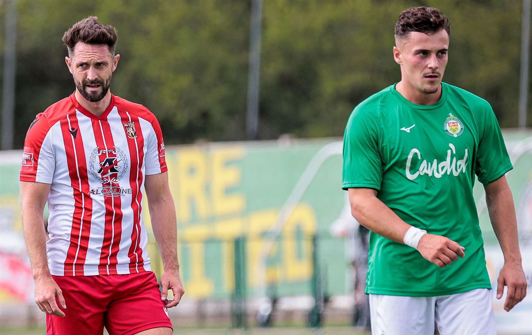 Dean Rance of Folkestone and Ashford attacker Louis Collins. Picture: Helen Cooper