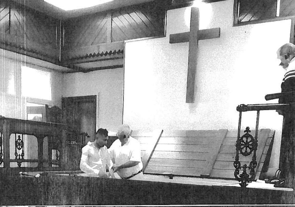 Abdul Ezedi, left, being baptised (Judicial Office/PA)