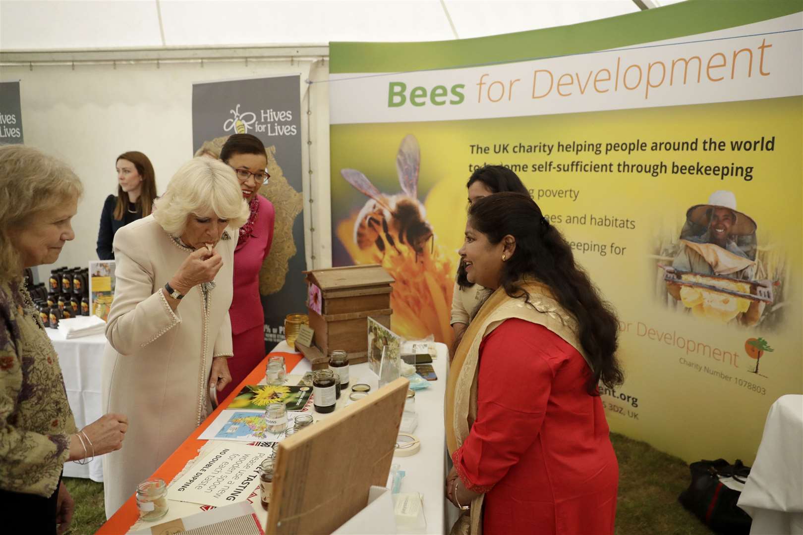 The Duchess of Cornwall trying some Indian honey at the Bees for Development Garden Party in 2019 (Matt Dunham/PA)