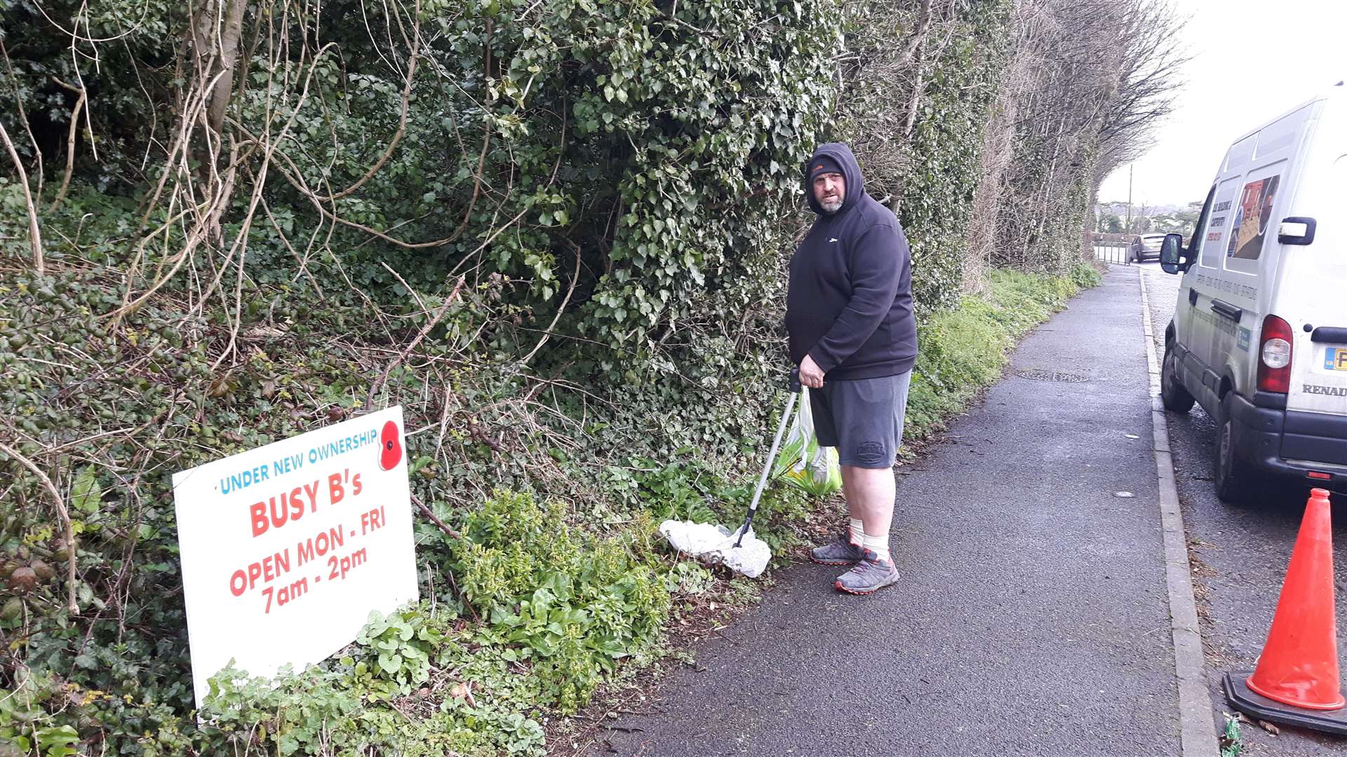 Dave Brock clears up rubbish from the bay to keep the area clean for Busy Bees' customers