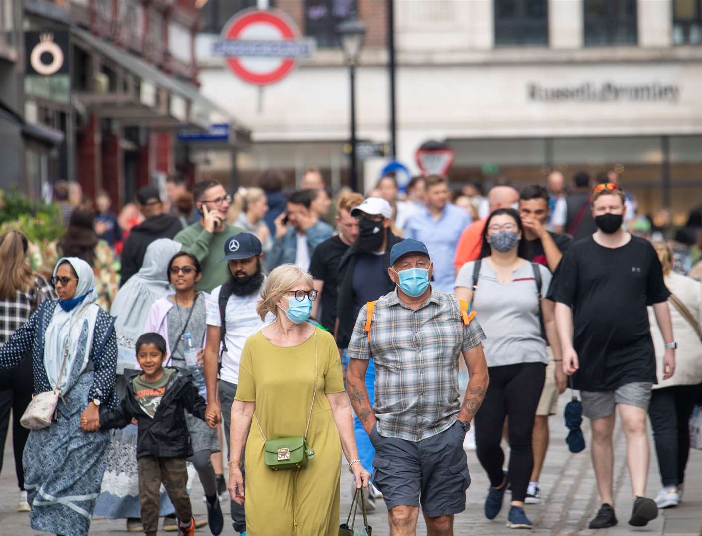 The majority of the public said they will continue covering faces when shopping (Dominic Lipinski / PA)