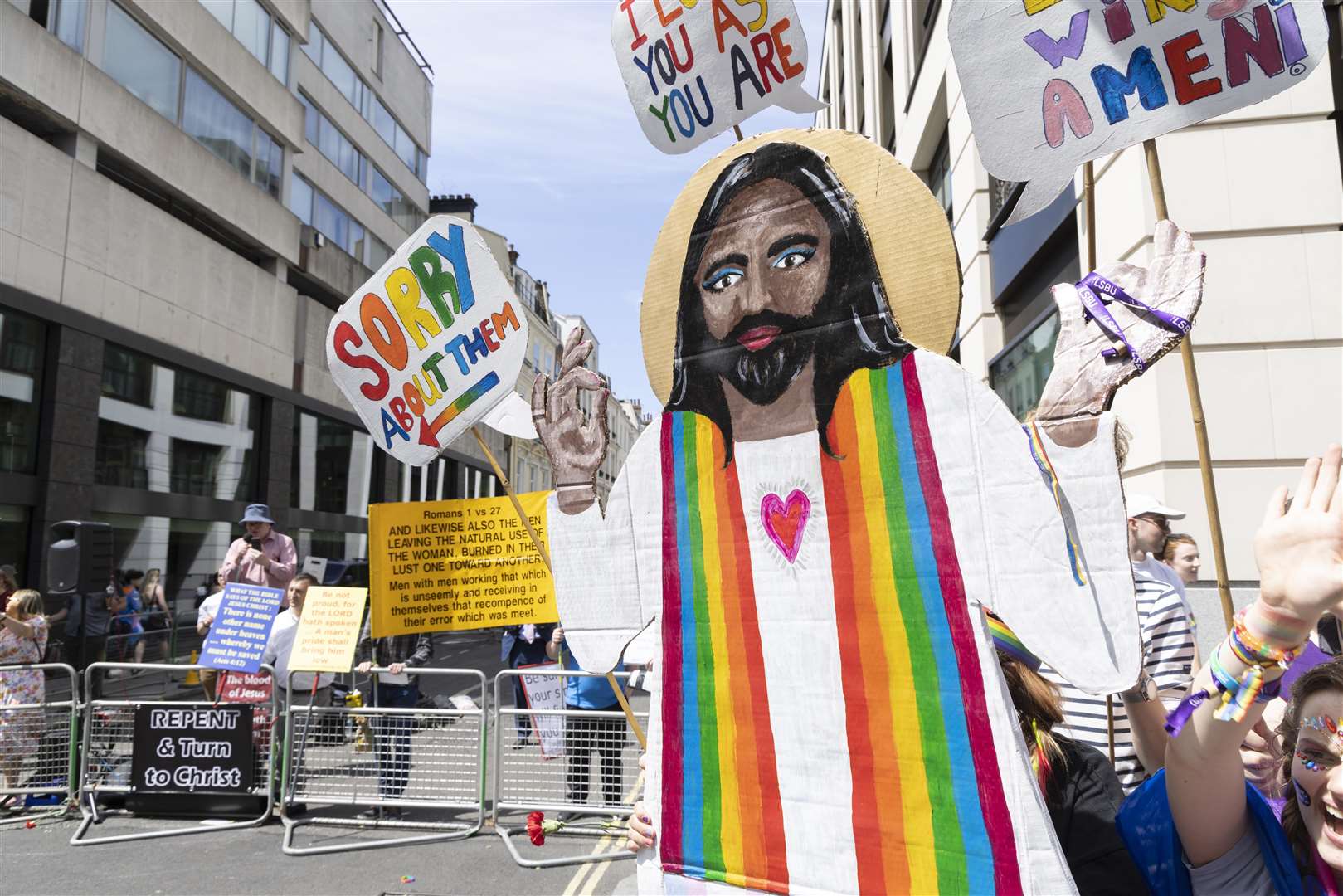 Beside a Christian counter-protest was a cardboard cut-out of Jesus Christ holding a sign saying ‘I’m sorry about them’ (Tim Anderson/PA)