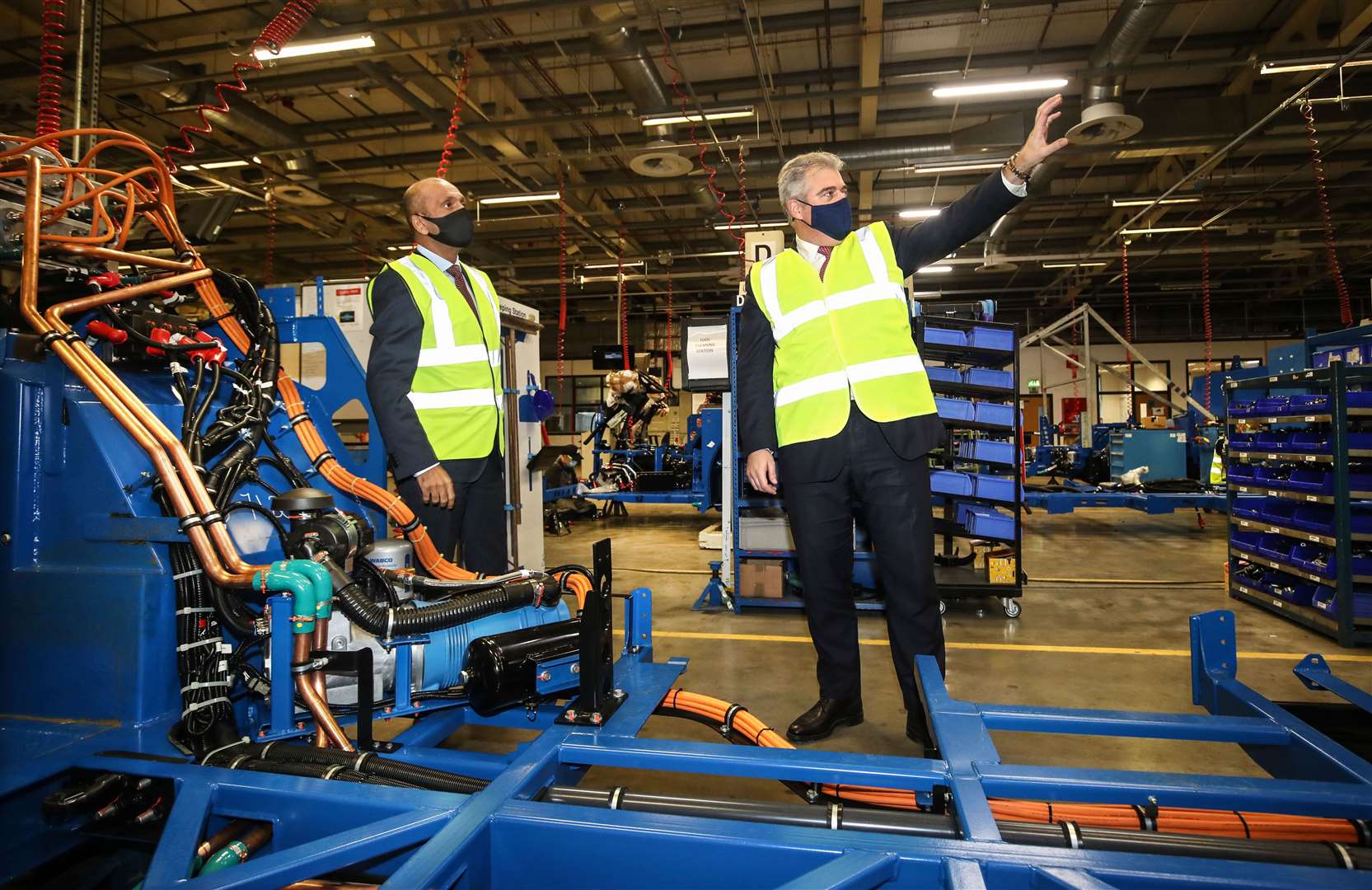 Brandon Lewis visited the Ballymena-based Wrightbus manufacturer, which has exported buses around the world (NIO/PA)