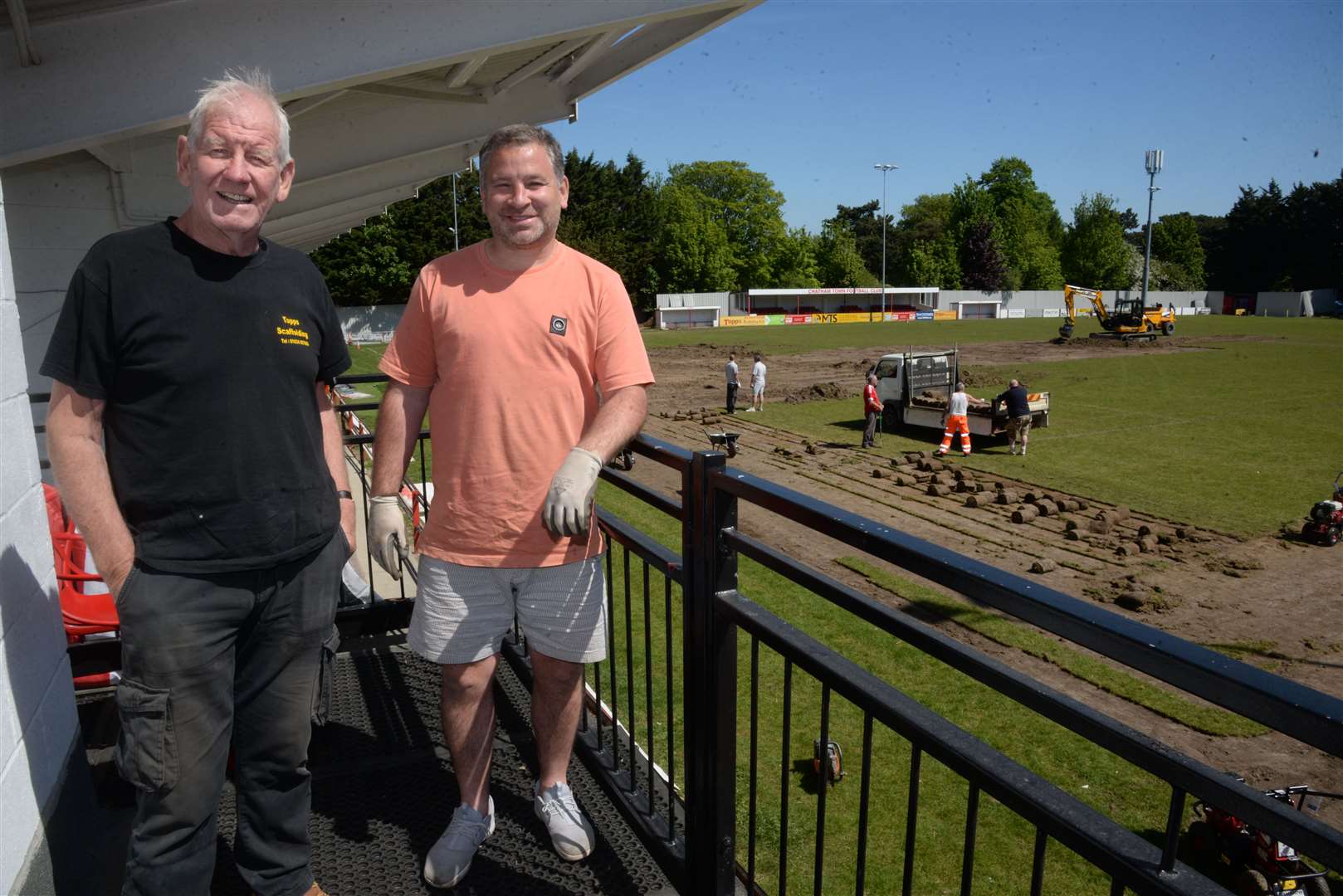 Chairman Kevin Hake, right, and vice chairman Barry Adams pversee work to install the new 3G pitch at the ground last May. Picture: Chris Davey