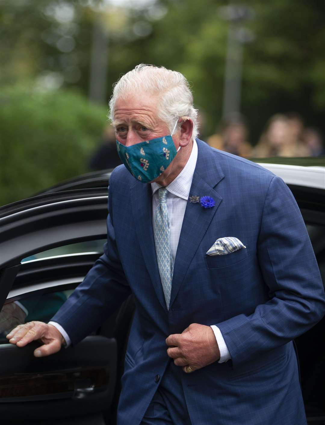 The Prince of Wales in his Turquoise Mountain mask in Belfast (Ian Vogler/Daily Mirror/PA)