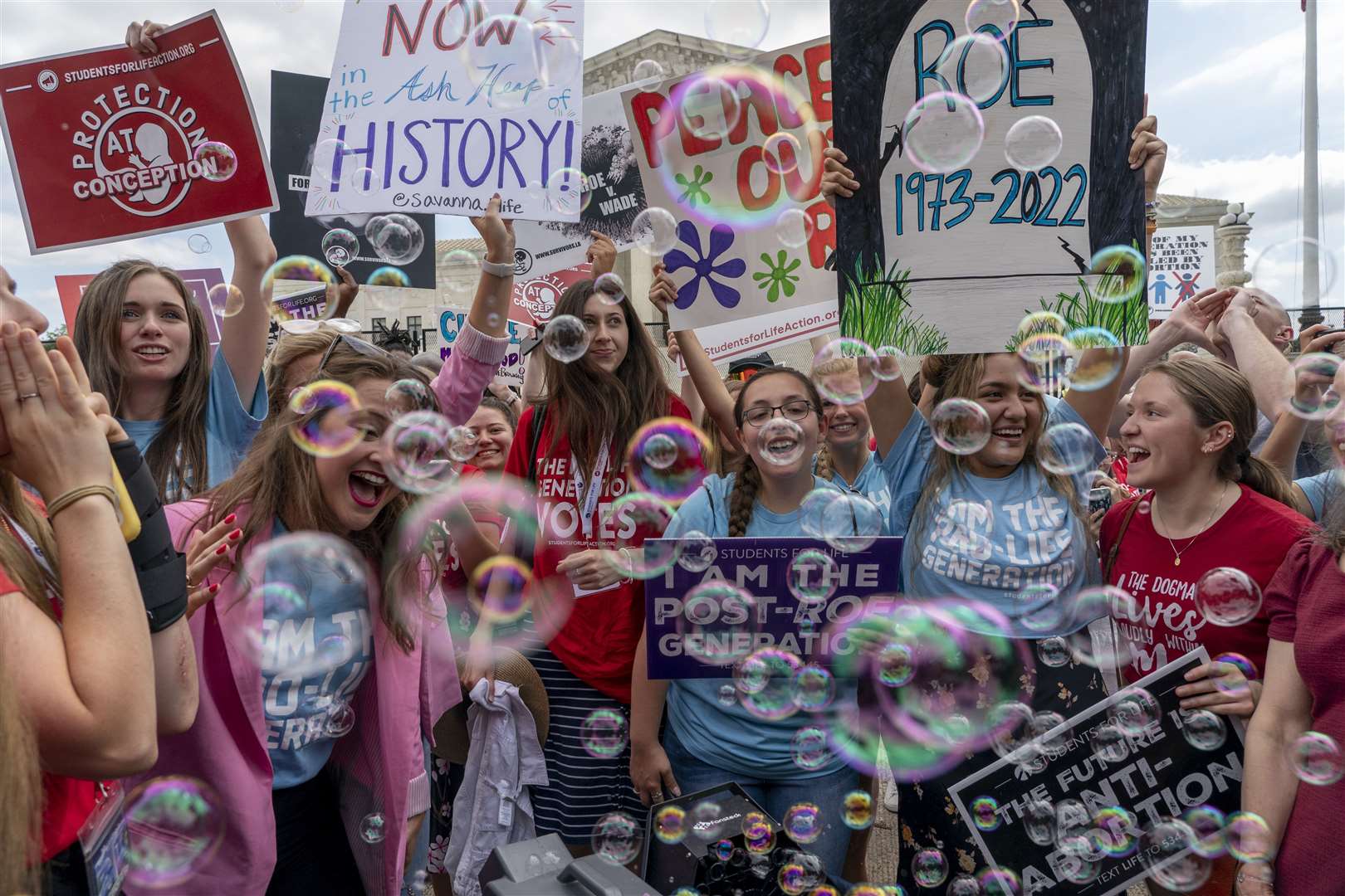 Anti-abortion protesters celebrate following the Supreme Court’s decision (Gemunu Amarasinghe/AP)