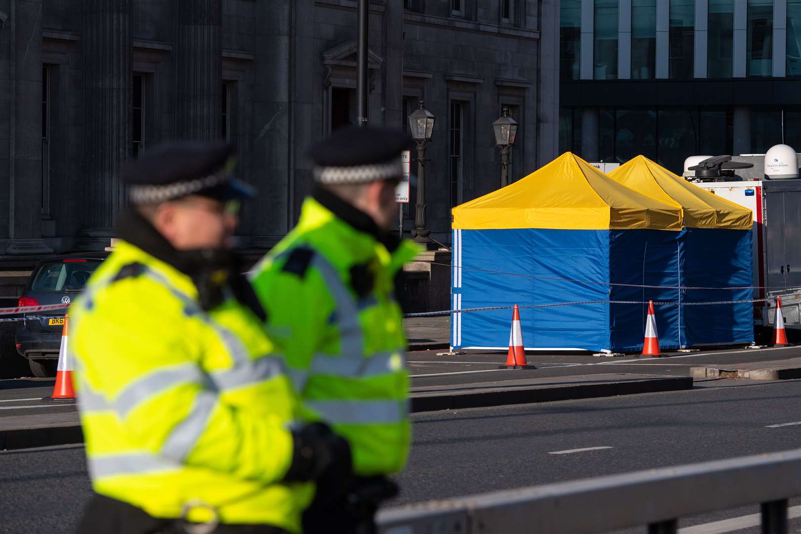 Police tents outside Fishmonger’s Hall, on London Bridge, following the terrorist attack (Dominic Lipinski/PA)